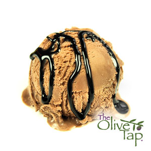 A scoop of chocolate gelato drizzled with strawberry balsamic vinegar with a white background and The Olive Tap logo in the righthand corner.