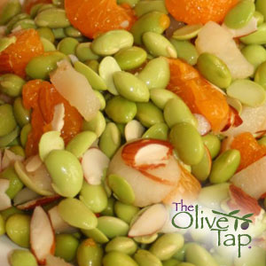 An edamame salad with mandarin segments, almond slices, and water chestnuts