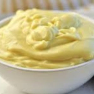Creamy, whipped mayonnaise served in a white bowl.