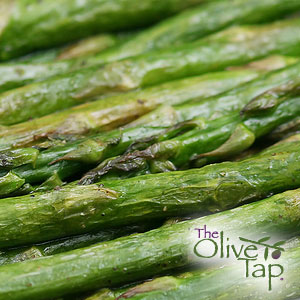 A close-up of roasted asparagus spears with lightly caramelized edges.