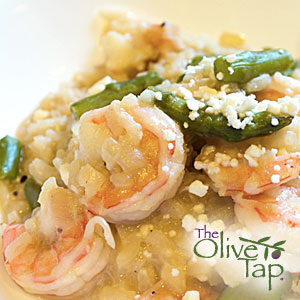 Creamy risotto topped with shrimp, asparagus, and parmesan cheese.