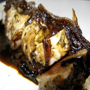 Sliced pork tenderloin topped with caramelized onions and a black current balsamic glaze.