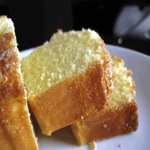 Slices of lemon pound cake served on a white plate.