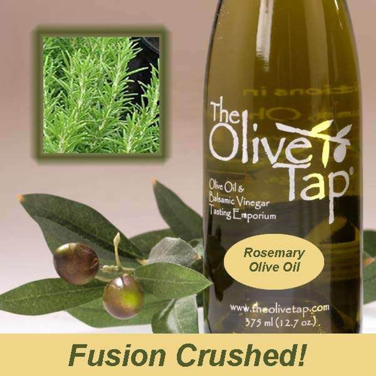 Bottle of Rosemary Olive Oil from The Olive Tap next to olives and leaves with an inset showing fresh rosemary on a light background and the words "fusion crushed" at the bottom.