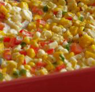 Creamed corn salad with diced bell peppers and jalapenos.