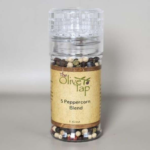 5 Peppercorn Blend in grinder jar from The Olive Tap with The Olive Tap logo and olive branch against a neutral background.