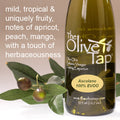 A bottle of Ascolano 100% Extra Virgin Olive Oil from The Olive Tap with olives and leaves including text describing the olive oil flavor profile on a light background.