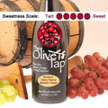 Bottle of Bordeaux Cherry Riserva Balsamic Vinegar from The Olive Tap with a picture of fresh cherries on it, surrounded by grapes in front of a wooden barrel, and a sweetness scale indicating a five.