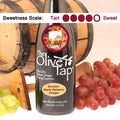A bottle of Bourbon Maple Balsamic Vinegar from The Olive Tap with a picture of a glass of bourbon and maple leaves, surrounded by grapes in front of a wooden barrel, and a sweetness scale indicating a four on a light background.
