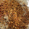 Mesquite Seasoning from The Olive Tap: a pile of orange and brown spices of different sizes.