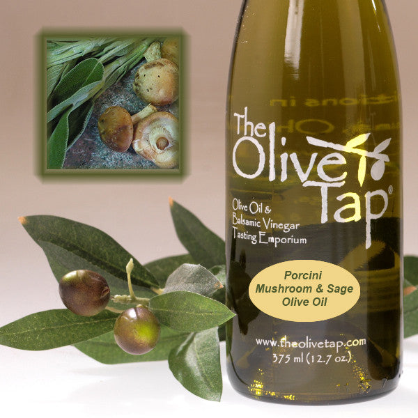 A bottle of Porcini Mushroom & Sage Olive Oil from The Olive Tap next to olives and leaves with an inset showing a fresh porcini mushrooms and sage.