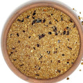 Spicy Smoked Bacon Sea Salt from The Olive Tap: tan grains of salt and bacon mixture with chipotle pepper pieces.