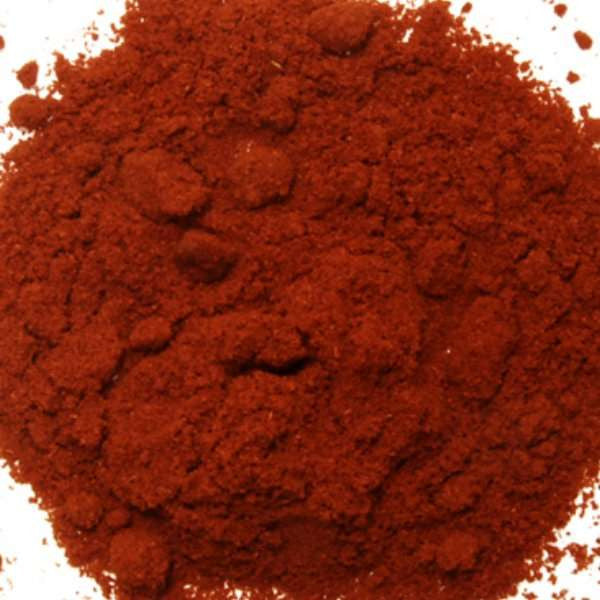 Smoked Spanish Paprika from The Olive Tap: A pile of red ground spice on a white background.
