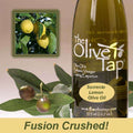 Bottle of Sorrento Lemon Olive Oil from The Olive Tap next to olives and leaves with an inset showing fresh lemons on trees and the words "fusion crushed!" at the bottom of the picture.