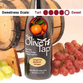 A bottle of Tangerine Balsamic Vinegar from The Olive Tap with a picture of tangerines surrounded by grapes in front of a wooden barrel, and a sweetness scale indicating a four.
