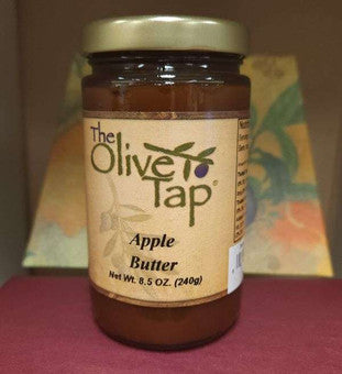 A jar of Apple Butter from The Olive Tap with a colorful background.