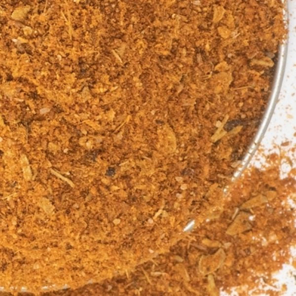 Fajita Seasoning from The Olive Tap: A metal bowl with red ground spices.