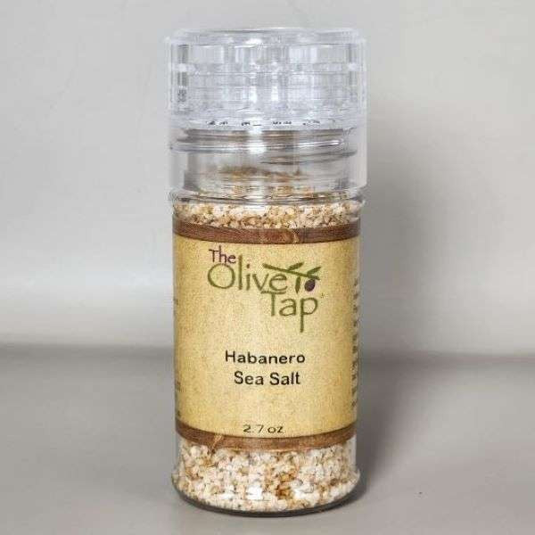 Habanero Pepper Sea Salt in a grinder jar from The Olive Tap with The Olive Tap logo and olive branch against a neutral background.