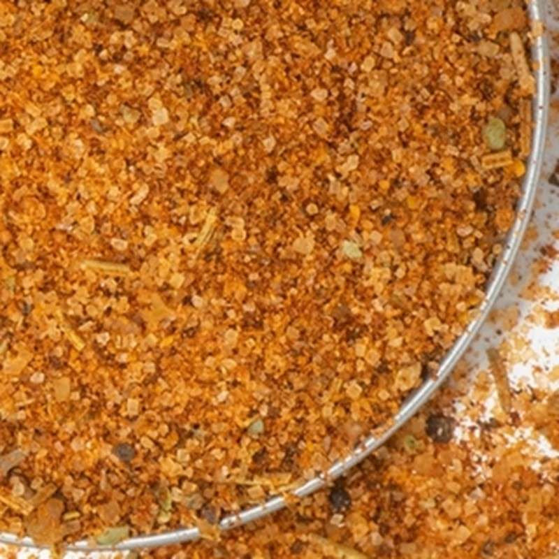 Rib Rub from The Olive Tap: grains of brown sea salt and herbs in a metal bowl.