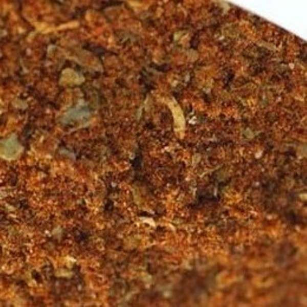 Salt-Free Chicken Seasoning from The Olive Tap: Brownish-red ground spices with green and tan pieces mixed in.