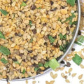Salt-Free Garlic and Herb Seasoning from The Olive Tap: A bowl of seasoning made up of green, tan, brown, and orange pieces.