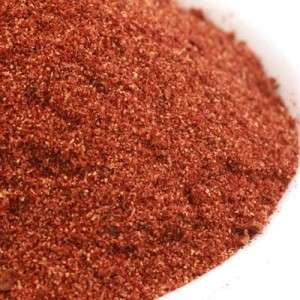 The Olive Tap's Salt Free Taco Seasoning: a pile of red ground spices in a white bowl.